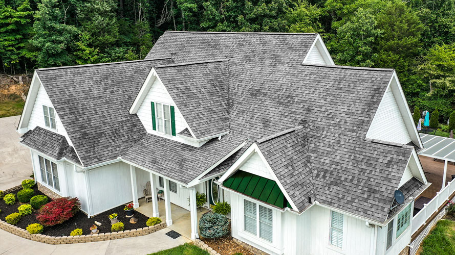 Aerial view of a home before and after a new architectural shingle roof — before