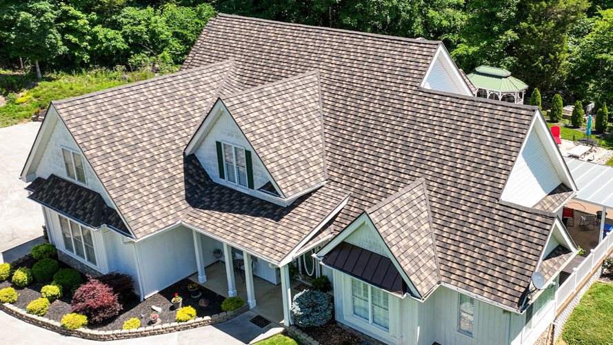 Aerial view of a home before and after a new architectural shingle roof — after